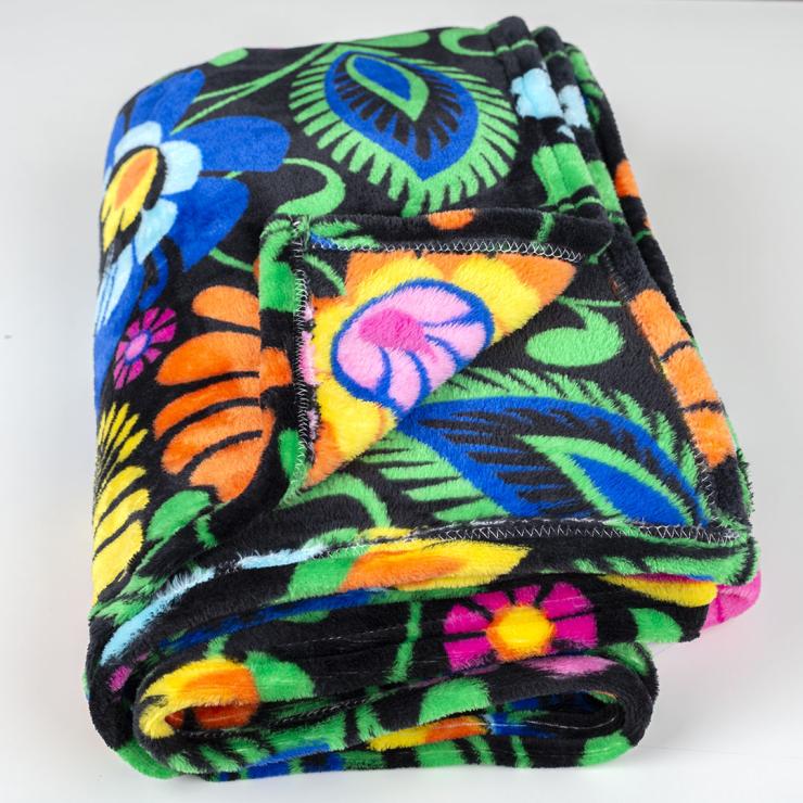 polish folk blanket with lowicz flower pattern on black background