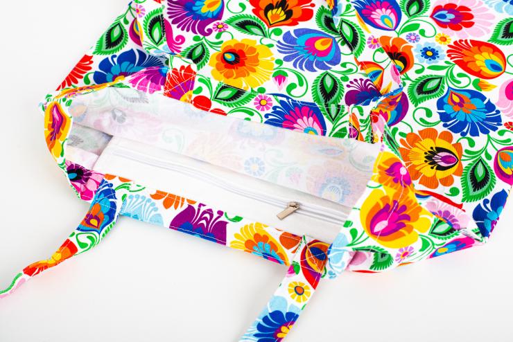 zipped pocket sewn into the inside of a white lowicz flowers cotton bag