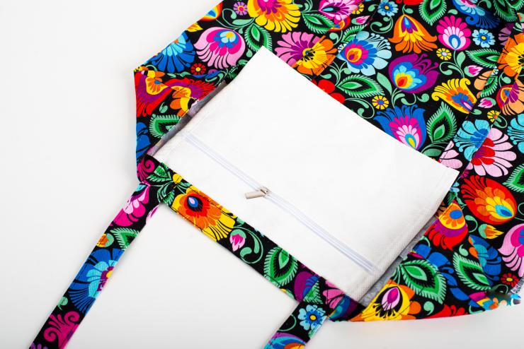 zipped pocket sewn into the inside of the black lowicz flowers folk cotton bag