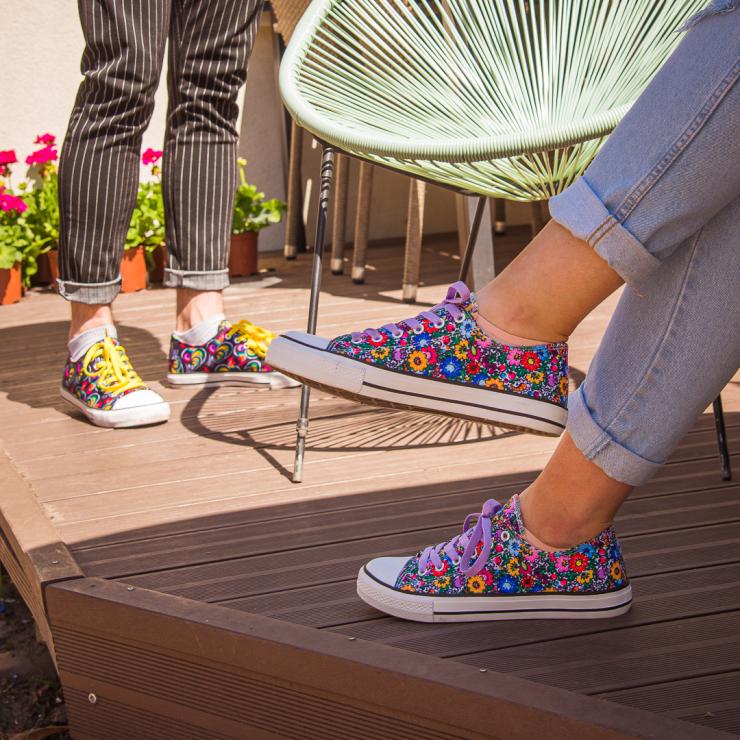 models wearing folk trainers decorated with polish folk patterns
