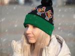folk beanie with lowicz roosters pattern on a model